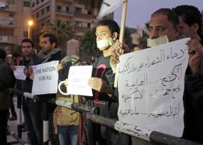 Demonstrators hold a vigil in Cairo in January 2011 against violence targeting Coptic Christians